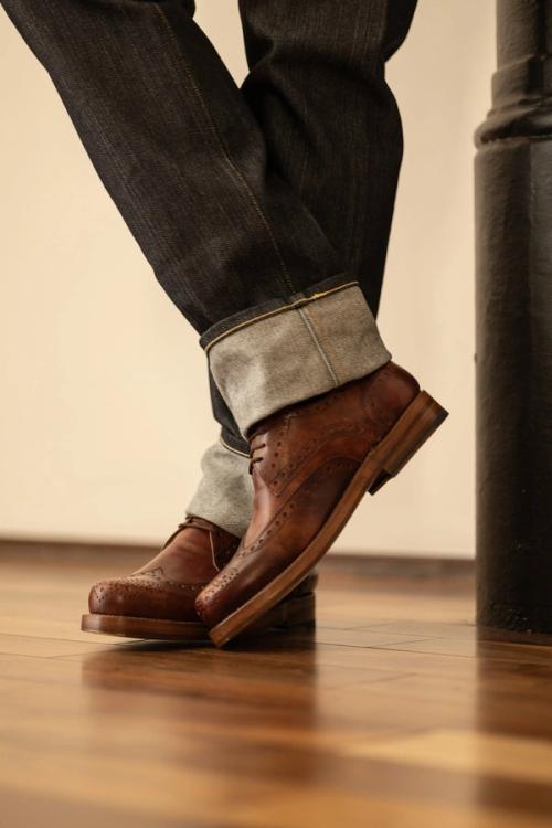 Boot moody interior lifestyle photography on hardwood — ecommerce photo GoPackshot