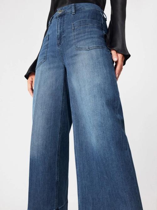 Jeans front patch pocket detail — on-model macro GoPackshot