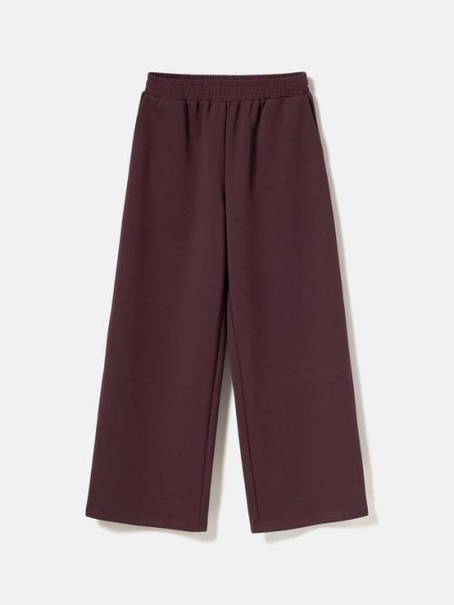 Pants flat-lay packshot on light background — womenswear ecommerce GoPackshot