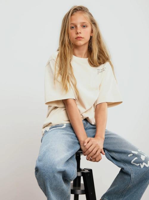 Kids t-shirt and jeans on-model photography — childrenswear ecommerce GoPackshot