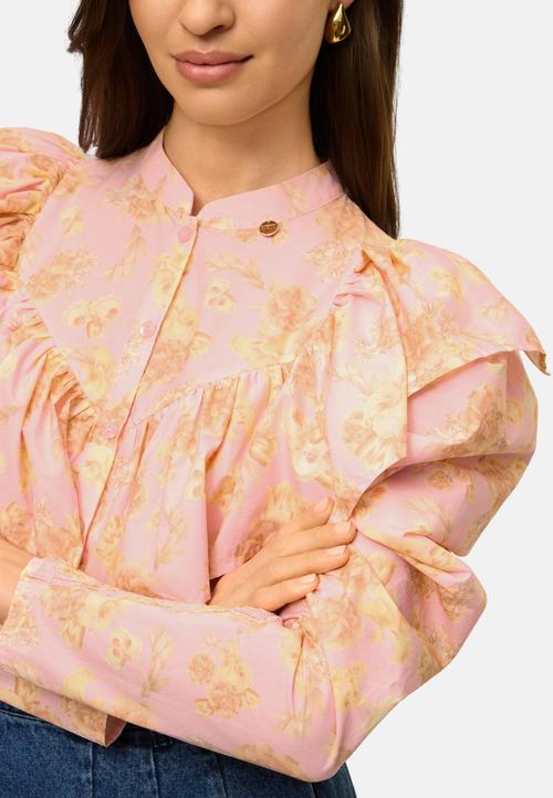 Ruffled blouse sleeve detail on-model photography — womenswear ecommerce GoPackshot