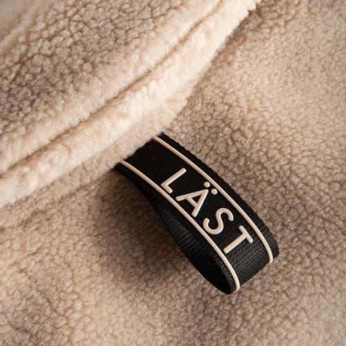 Jacket label detail close-up photography — womenswear ecommerce studio GoPackshot