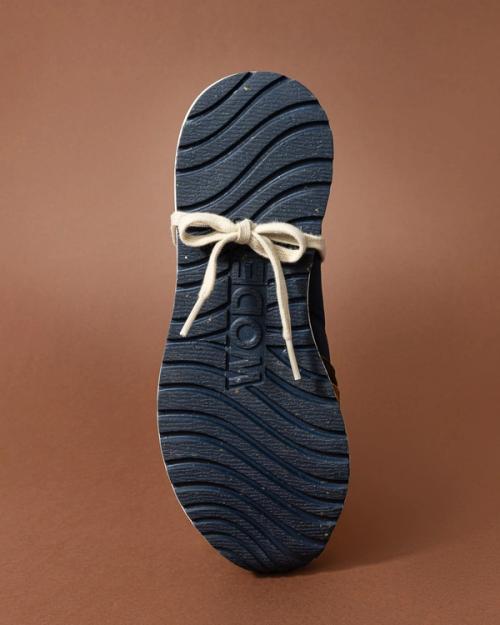 Sneaker sole detail close-up on colored background — product photography GoPackshot