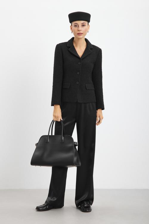 Black boucle blazer on-model photography in studio — womenswear ecommerce GoPackshot