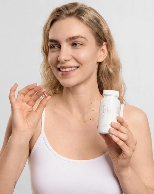 Dietary supplement bottle on-model beauty photography — GoPackshot studio
