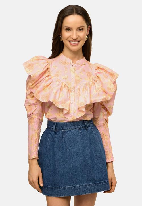 Ruffled floral blouse on-model photography with denim skirt — womenswear GoPackshot