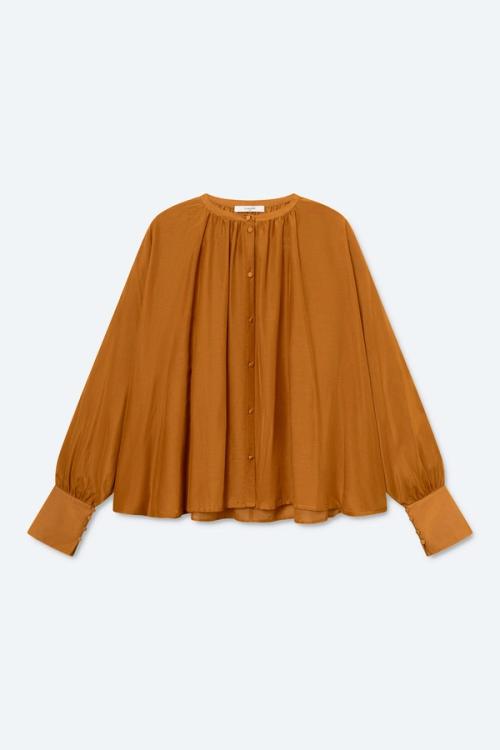 Blouse flat-lay packshot on light background — womenswear ecommerce GoPackshot