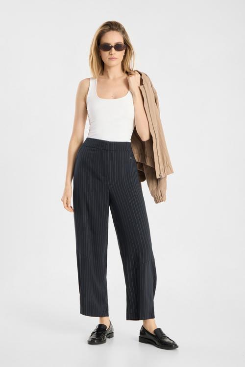 Pinstripe trousers on-model photography in studio — womenswear ecommerce GoPackshot