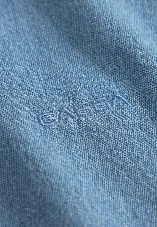 Denim shirt embroidered logo detail — macro studio GoPackshot