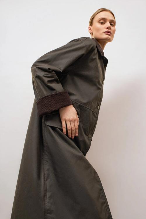 Coat on-model dynamic pose photography — womenswear ecommerce studio GoPackshot