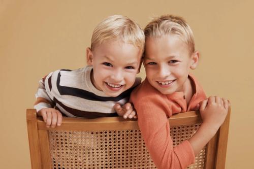 Kids duo on-model photography in studio — childrenswear ecommerce GoPackshot