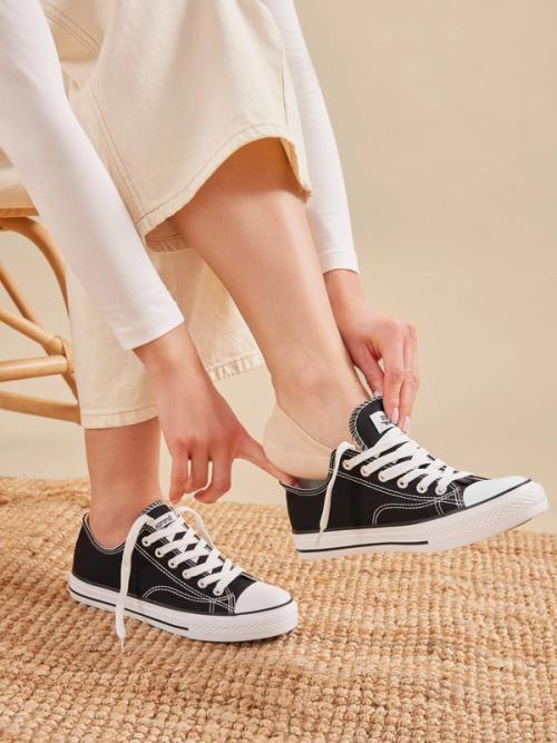 Sneaker lifestyle photography capturing lacing moment — ecommerce photo GoPackshot