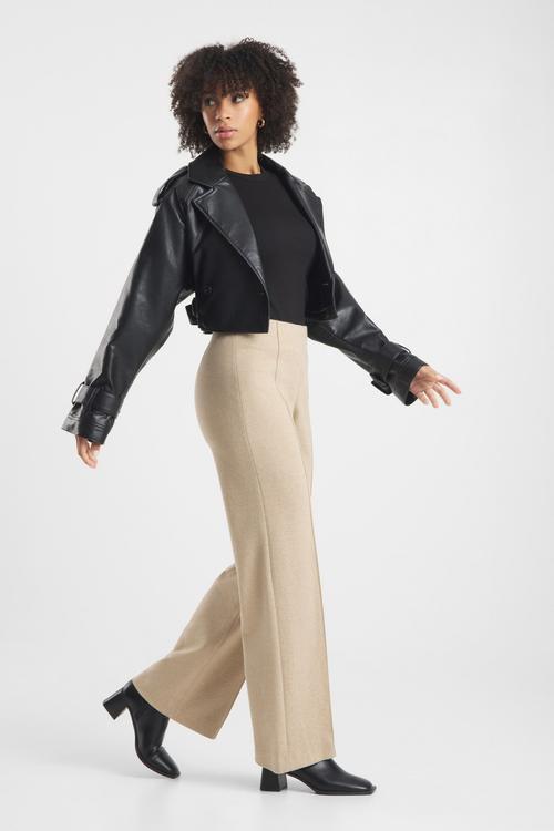 Wide-leg trousers on-model photography in walking pose — womenswear GoPackshot