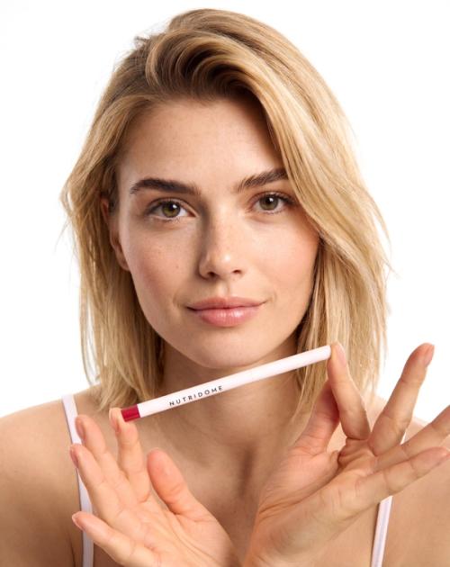 Lip liner held on-model in beauty portrait photography — GoPackshot studio