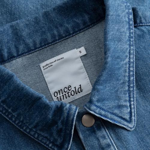 Denim jacket collar label detail — macro photography GoPackshot