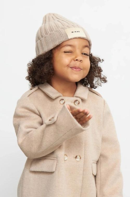 Kids coat on-model photography in studio — childrenswear ecommerce GoPackshot