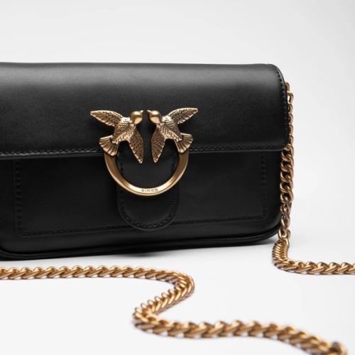 Crossbody bag clasp and chain detail close-up — GoPackshot studio