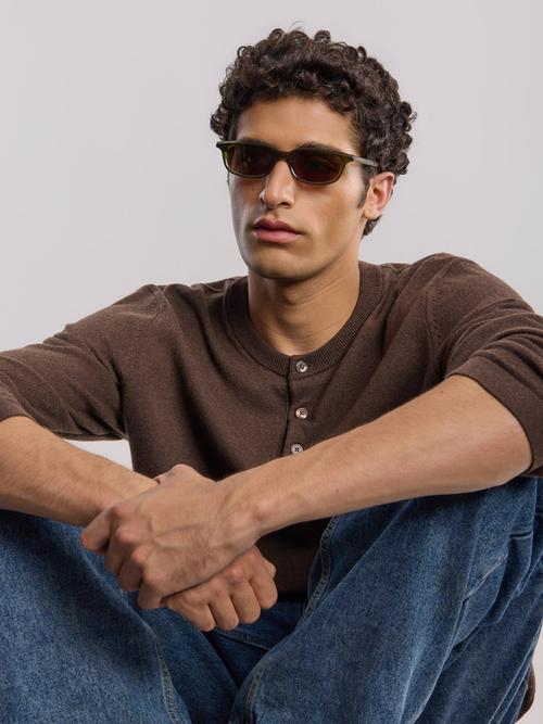 Olive sunglasses on-model photography with knitwear styling — eyewear GoPackshot