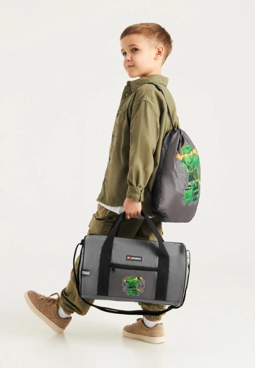 Kids outfit with bags on-model photography — childrenswear ecommerce GoPackshot