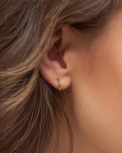 Earring on-model extreme close-up showing mini hoop — jewellery photography GoPackshot