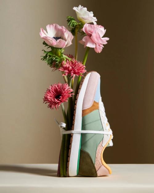 Sneaker creative still life with flower arrangement side view — GoPackshot