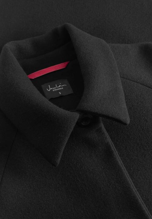 Coat collar label close-up photography — menswear studio GoPackshot