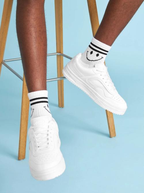 Sneaker on-model photography with blue studio backdrop — GoPackshot studio