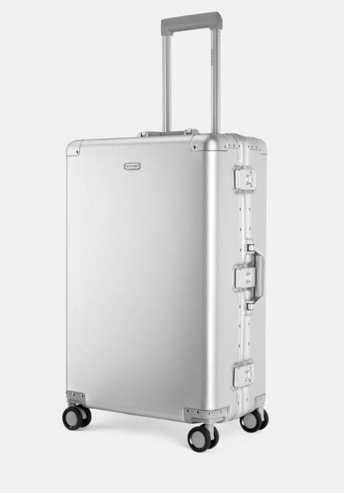 Suitcase spinner packshot on studio backdrop — ecommerce GoPackshot