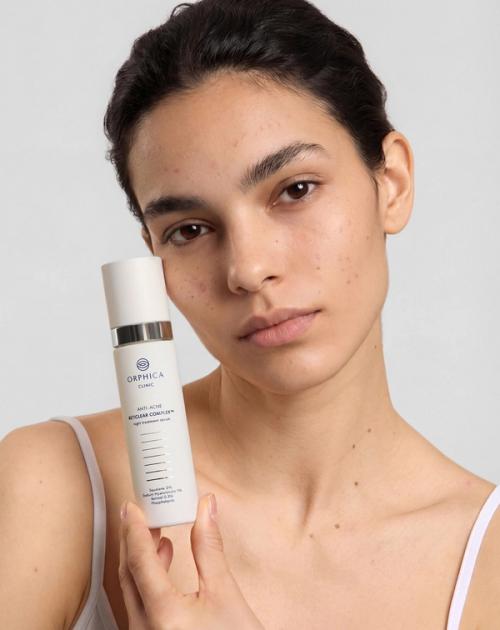 Skincare serum bottle on-model beauty photography — GoPackshot studio