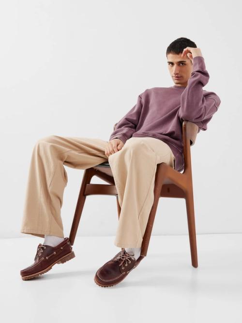 Boat shoe on-model photography in relaxed studio pose — GoPackshot studio