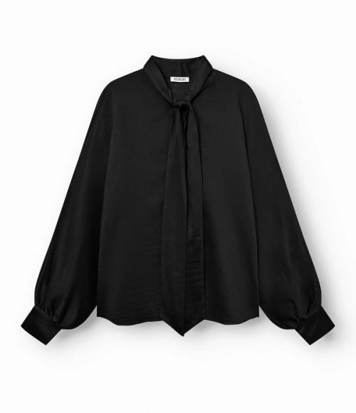 Blouse flat-lay packshot on white background — womenswear ecommerce GoPackshot