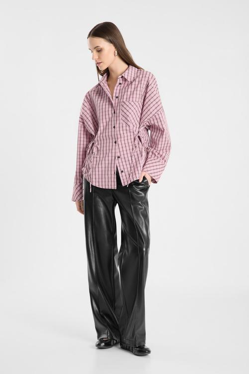 Leather trousers on-model photography with checked shirt — womenswear ecommerce GoPackshot