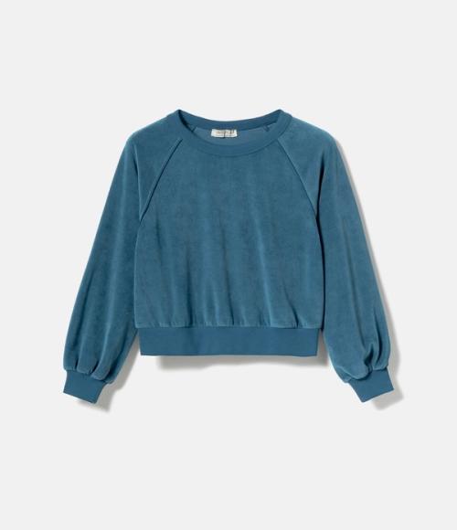 Sweater flat-lay packshot on light background — womenswear ecommerce GoPackshot
