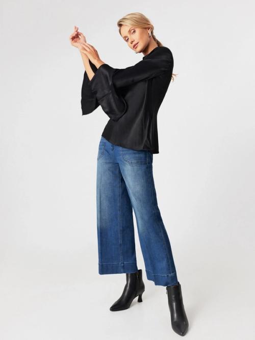 Blouse outfit on-model photography in studio — womenswear ecommerce GoPackshot