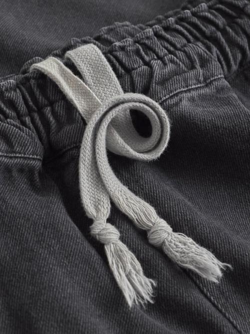 Jeans drawstring waistband detail — macro photography GoPackshot