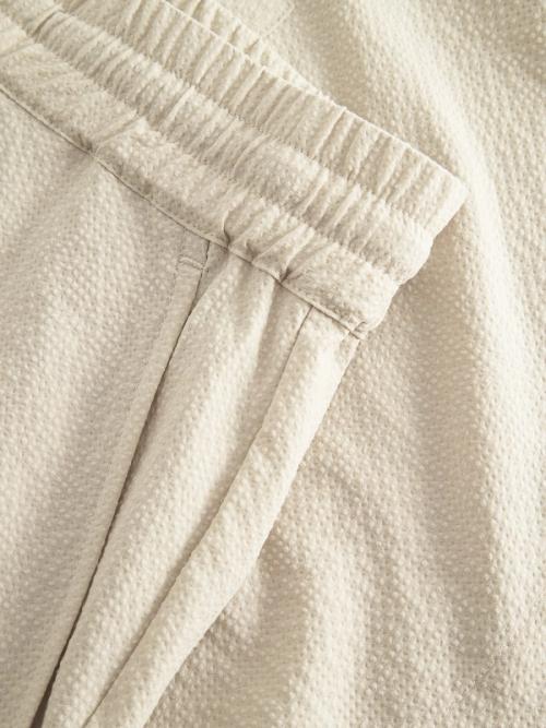 Pants fabric texture waistband detail photography — menswear GoPackshot