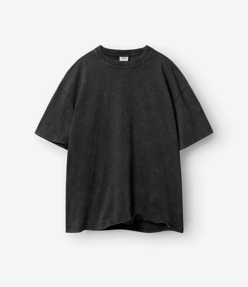 T-shirt flat-lay packshot on light background — ecommerce GoPackshot