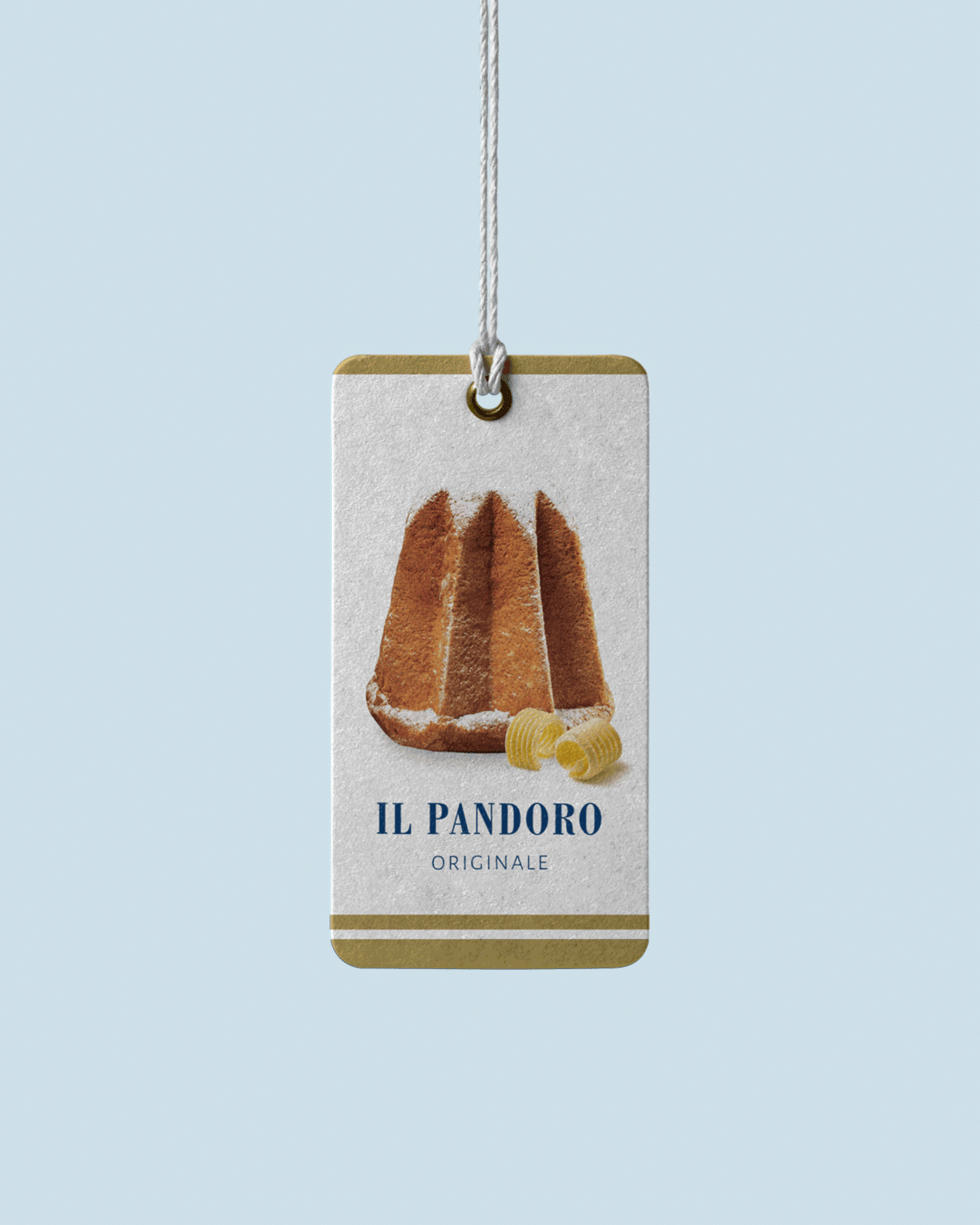 A tag featuring an image of the Pandoro Originale and butter curls, hanging from a string on a light-blue background.