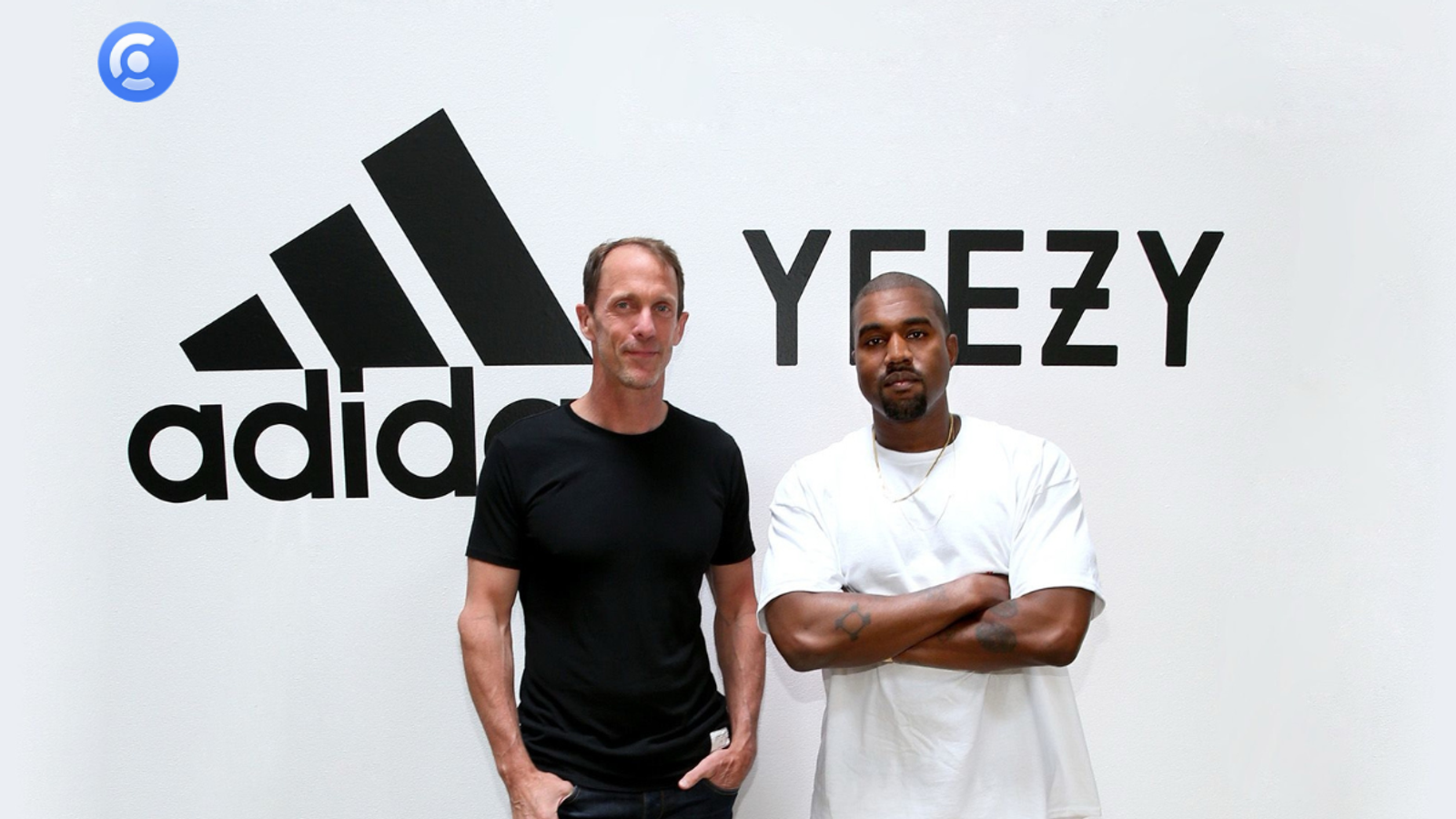 Kanye West in a white t-shirt standing with arms crossed next to an executive in front of a wall featuring the Adidas and Yeezy brand logos, used to illustrate influencer crisis management case studies on the Creally platform