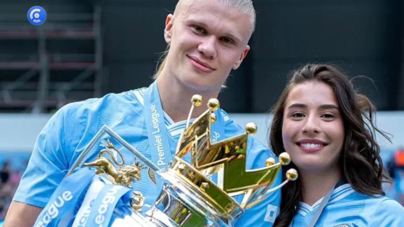 Footballer Erling Haaland and Isabel Haugseng Johansen holding a trophy, illustrating the entity pairing strategy and Scandinavian clean girl aesthetic framework for marketing campaigns on the Creally platform.