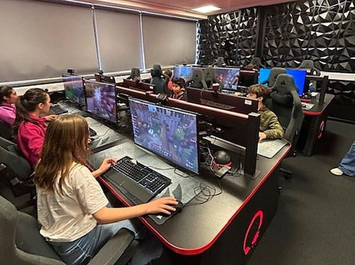 Pupils competing at gaming PCs in the DLD College esports suite