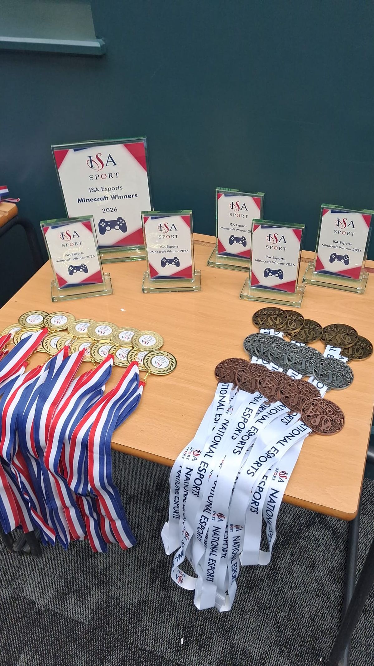 ISA Esports medals and awards on a table