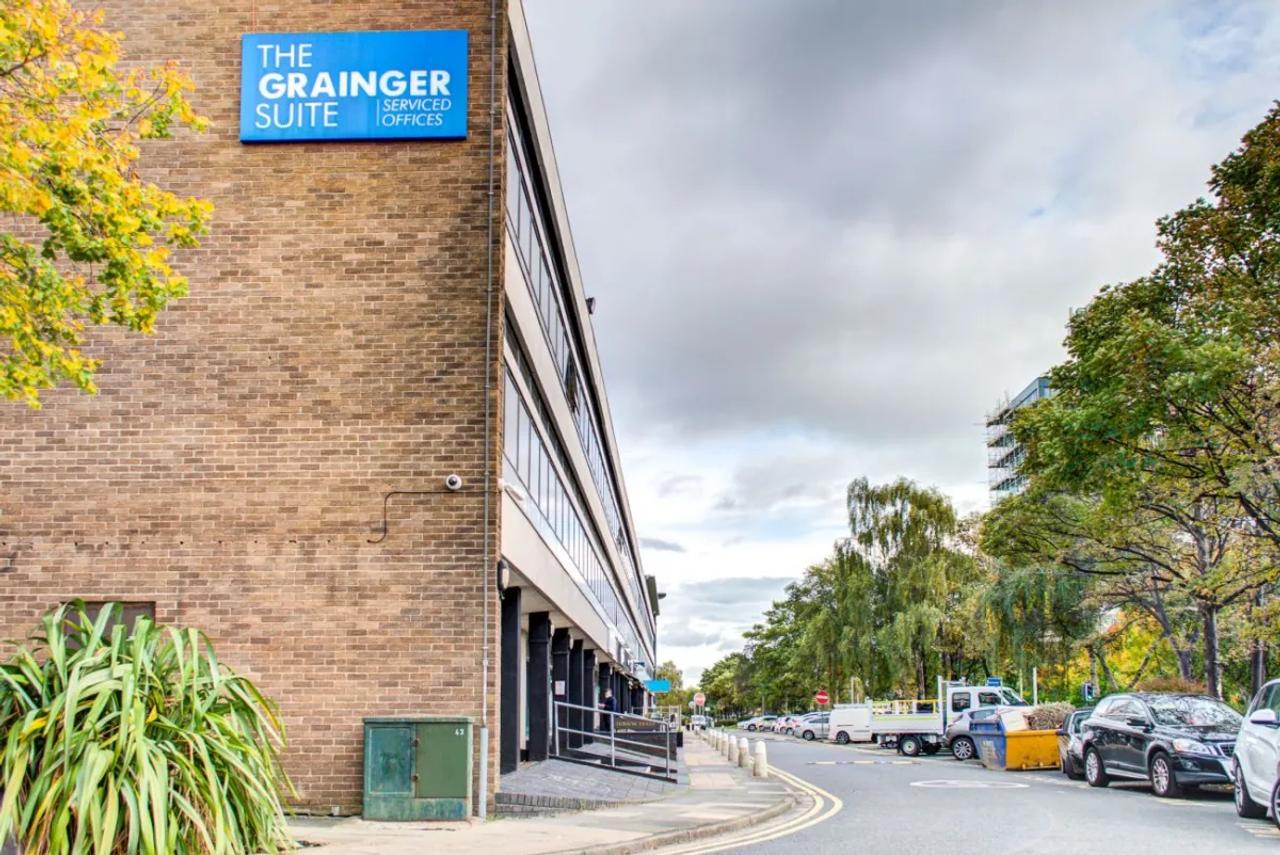 The brick building that houses our Newcastle clinic in Gosforth, on a tree-lined street