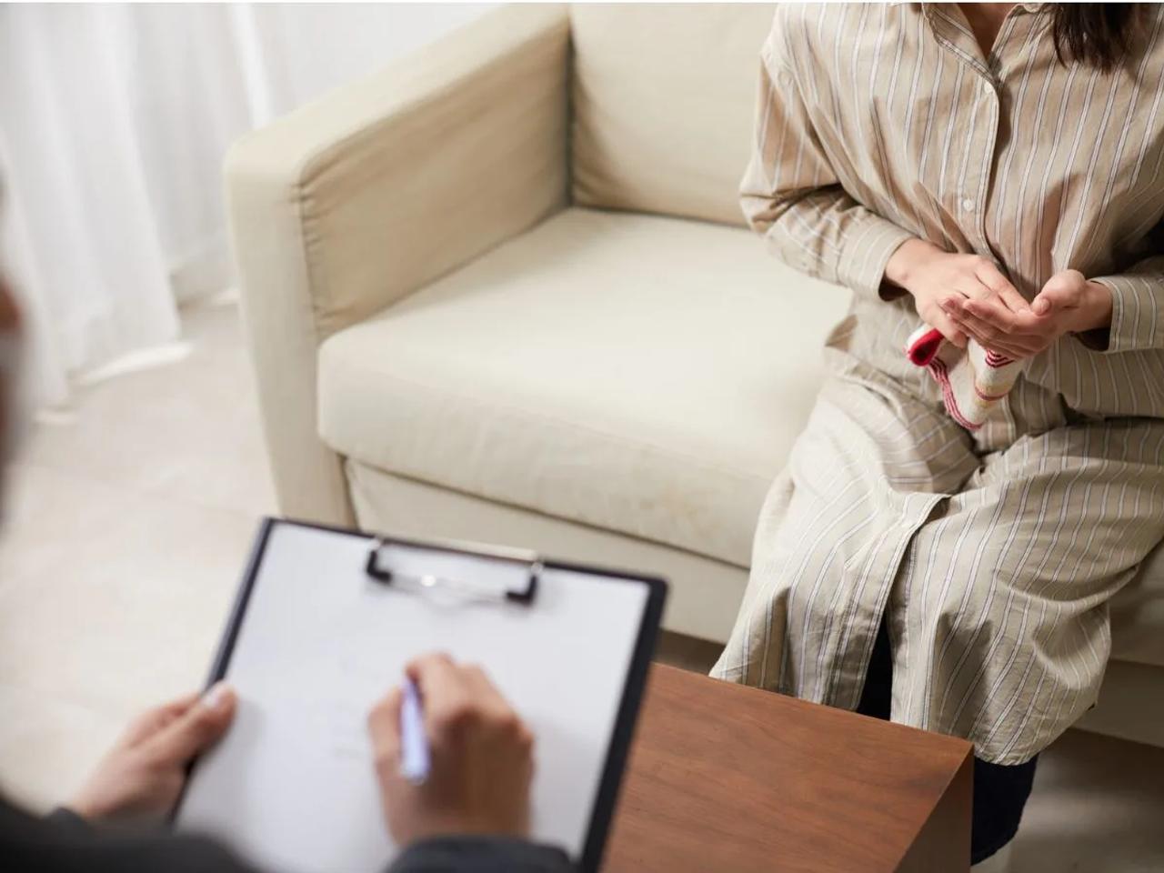 Psychologist counselling patient