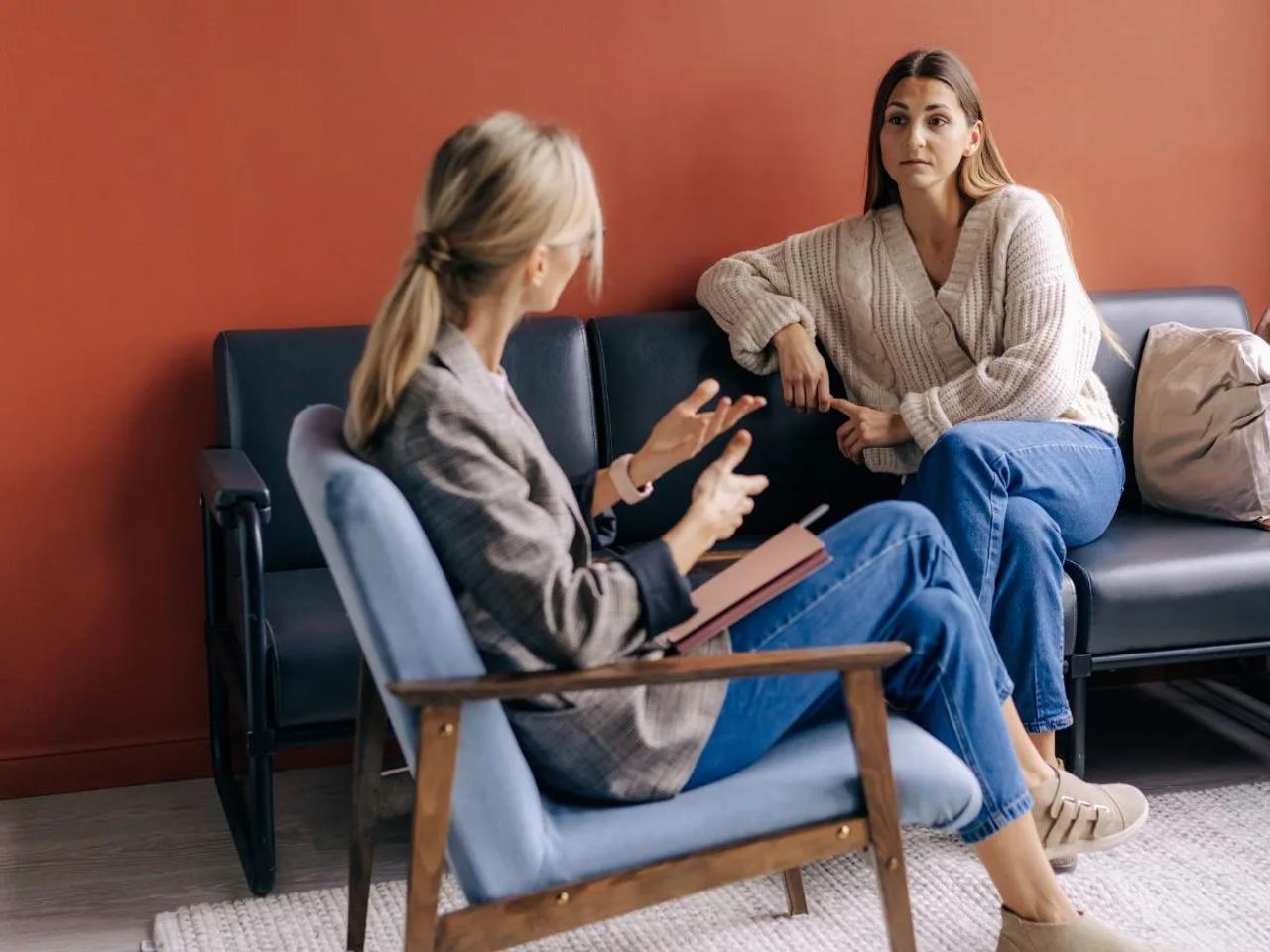 Psychologist talking with patient or CBT therapy session