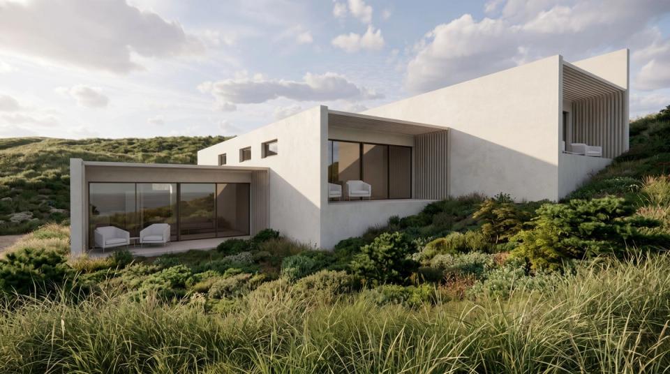 concrete cabins nested into the ground of a sloping site on the lush green sub tropical coastal lands of Byron Bay