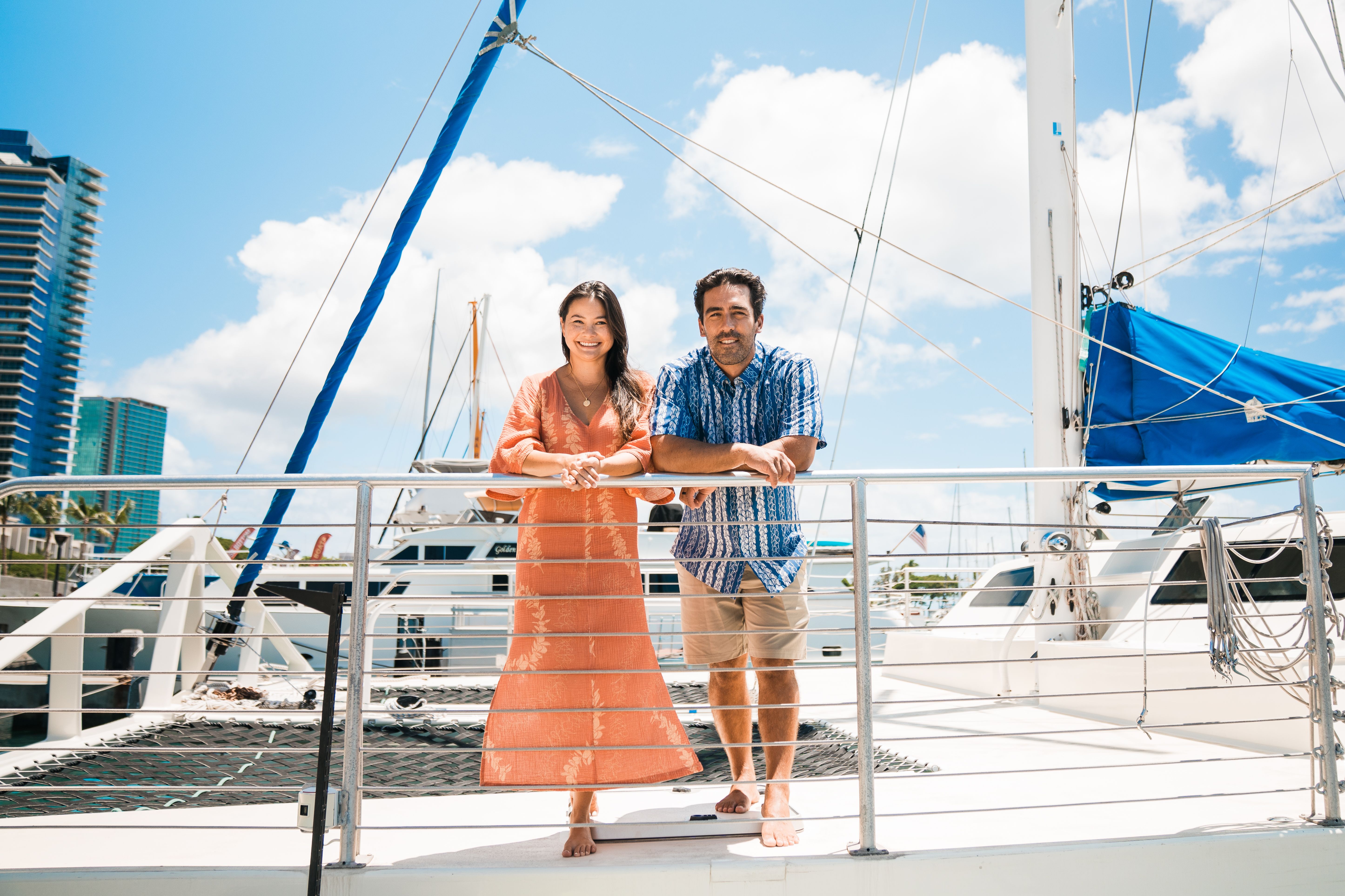Hawaii Nautical Entrepreneurs Mark and Tahnee Towill stand on the deck of one of their boats