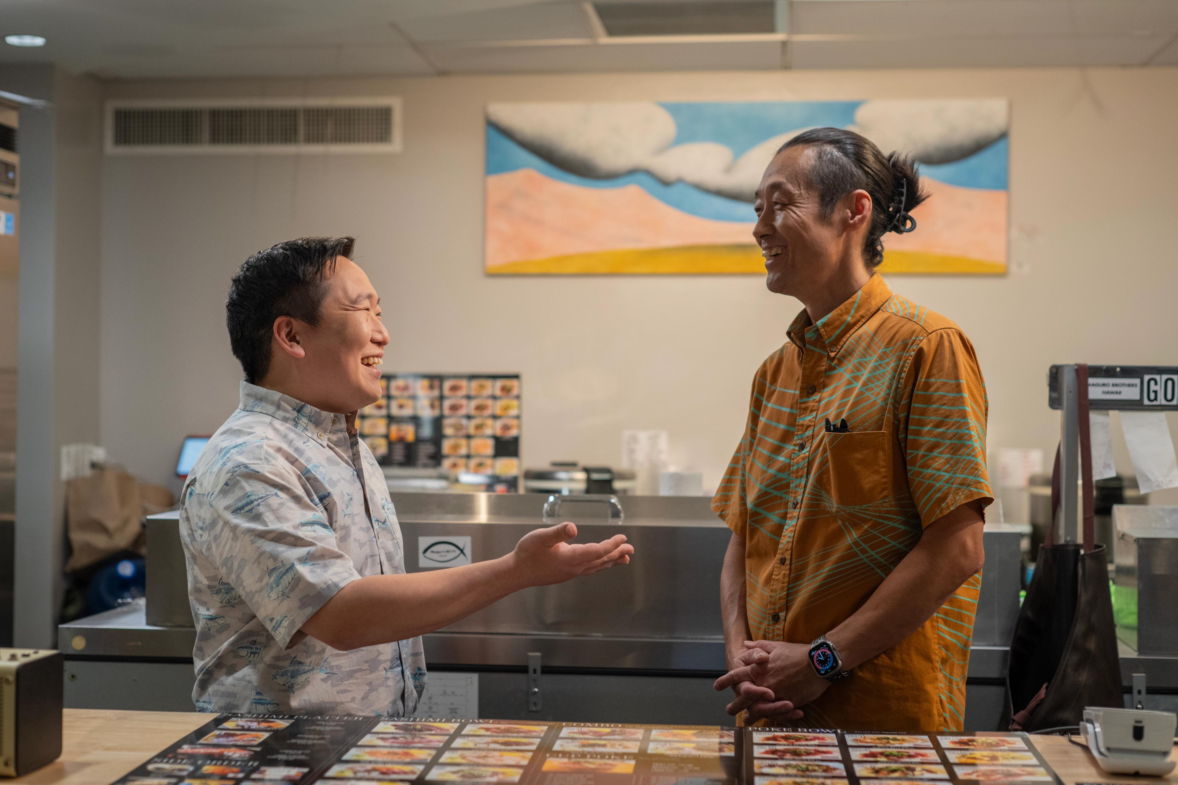 Maguro Brothers Entrepreneur Ryojiro Tsuchiya talks to his Hawaii National Bank Relationship Officer Kenneth Kuroda.