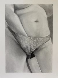 A woman holding a knife through her pants' leg hole