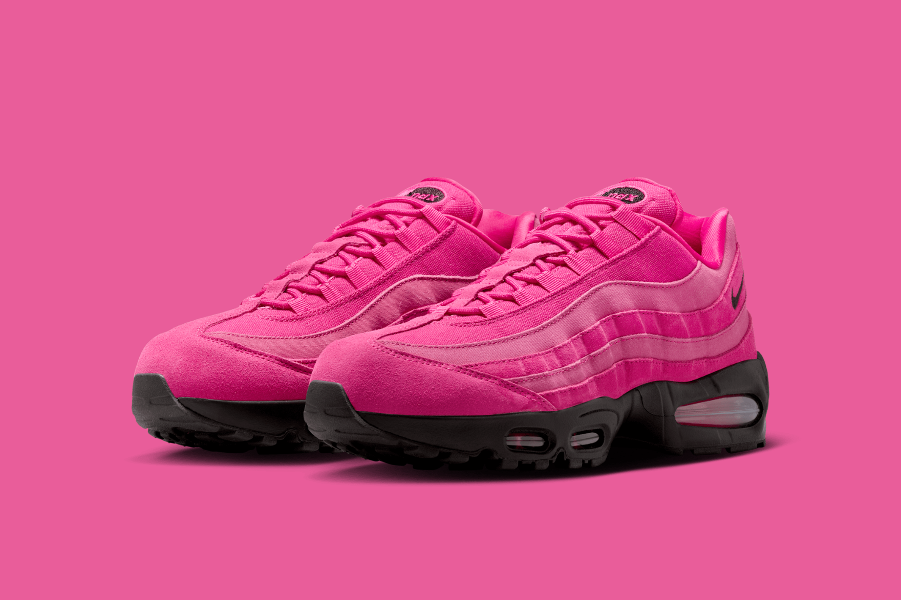 bright pink nike air max 95 sneakers on pink background